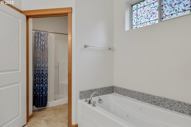 bathroom featuring tile patterned flooring and separate shower and tub