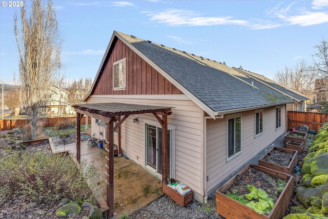 back of house featuring a patio area and a pergola