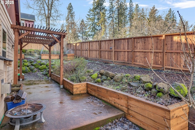 view of patio featuring a pergola and a fire pit