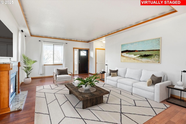 living room featuring crown molding and wood-type flooring