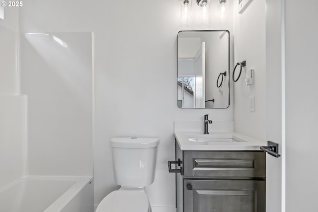 full bath featuring washtub / shower combination, vanity, and toilet