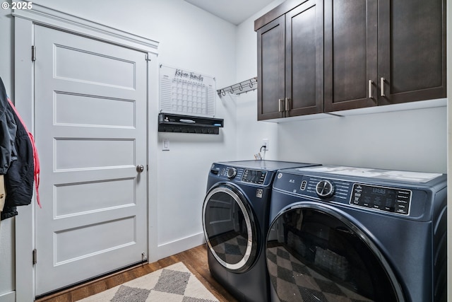 12703 NE 58th Ave, Vancouver, WA 98686 - clothes washing area with independent washer and dryer, cabinet space, dark wood finished floors, and baseboards