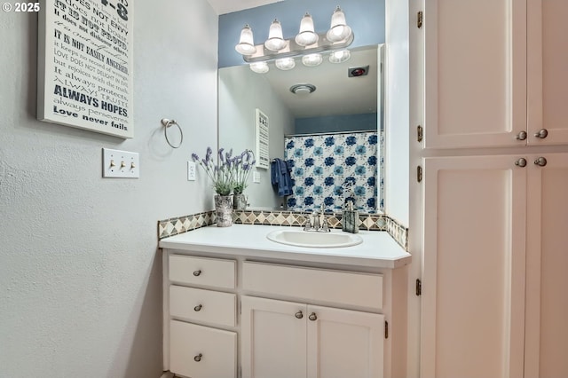 4388 NW Neskowin Ave, Portland, OR 97229 - bathroom featuring backsplash and vanity