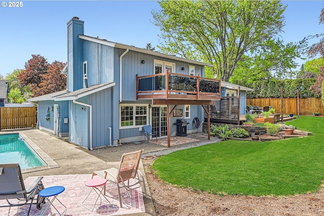 4388 NW Neskowin Ave, Portland, OR 97229 - rear view of house with a yard, a chimney, a fenced backyard, and a patio area