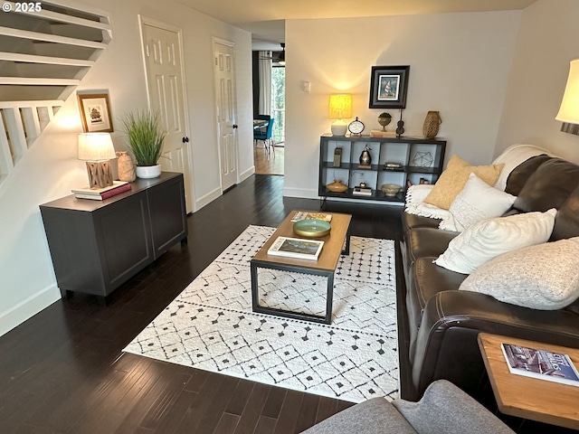 29640 SW Volley St Unit 39, Wilsonville, OR 97070 - living area featuring dark wood finished floors, baseboards, and stairway