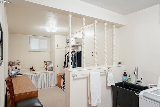 bathroom featuring washer / dryer
