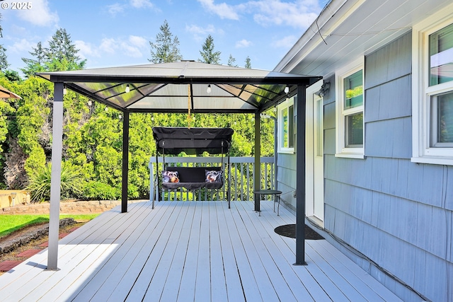 wooden terrace featuring a gazebo