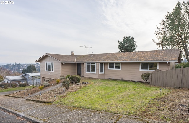 single story home with a front lawn