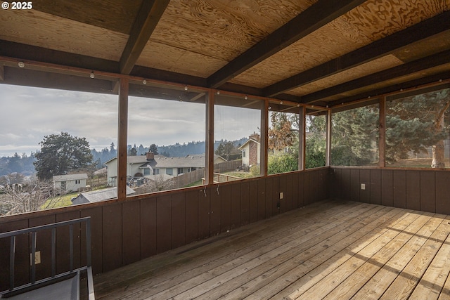 unfurnished sunroom with a wealth of natural light