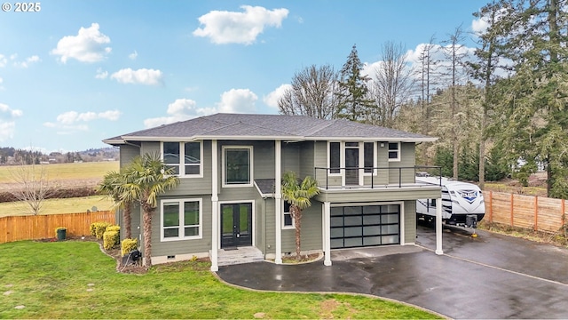 view of front of house featuring a garage and a front yard