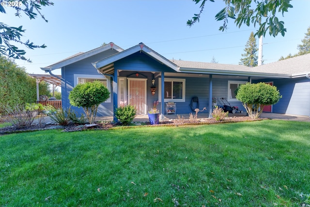 ranch-style home with covered porch and a front lawn