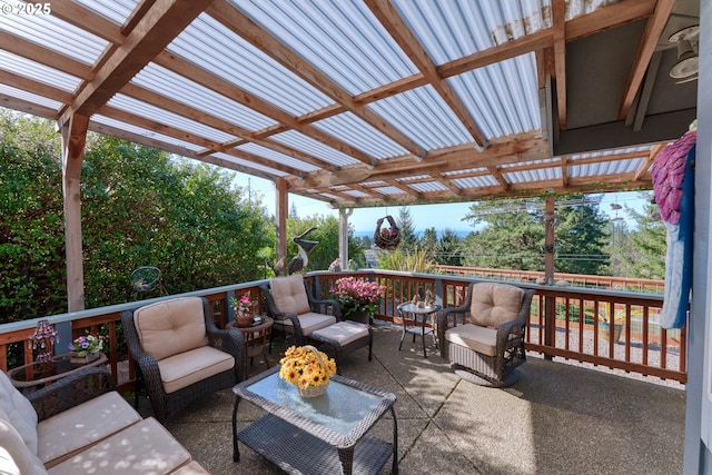 wooden terrace featuring an outdoor living space and a pergola