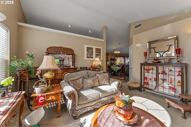 living area with lofted ceiling, carpet flooring, and visible vents