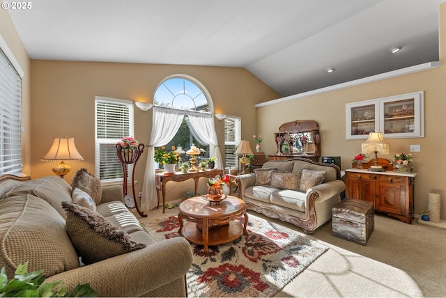 living area featuring light colored carpet and vaulted ceiling