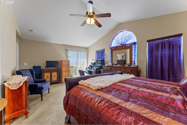 carpeted bedroom with lofted ceiling, multiple windows, and a ceiling fan