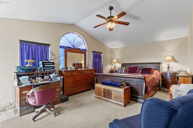 bedroom featuring ceiling fan, lofted ceiling, and light carpet