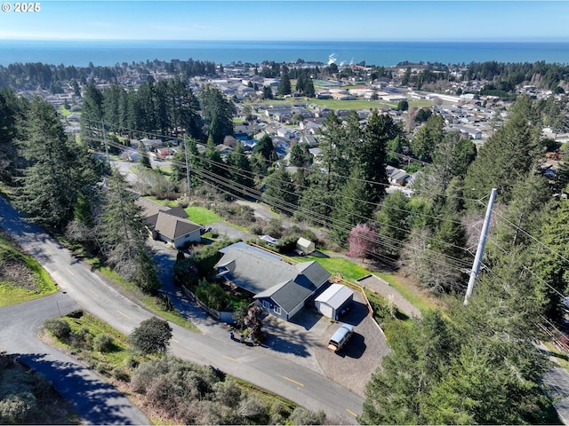 birds eye view of property with a water view