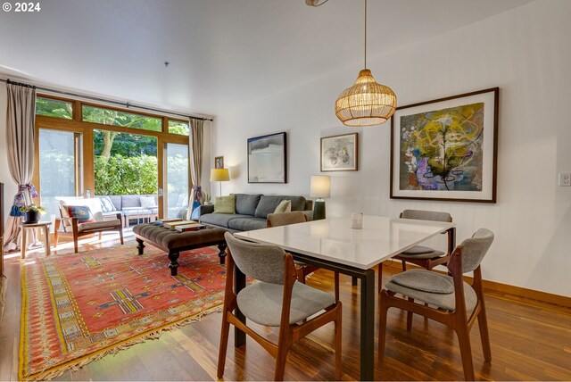 dining room featuring baseboards and wood finished floors