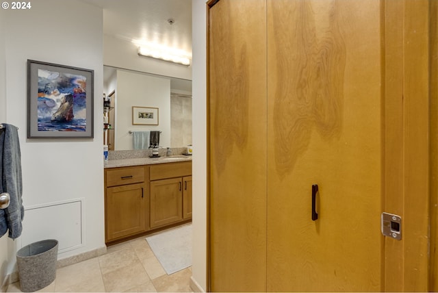 bathroom with vanity and tile patterned flooring