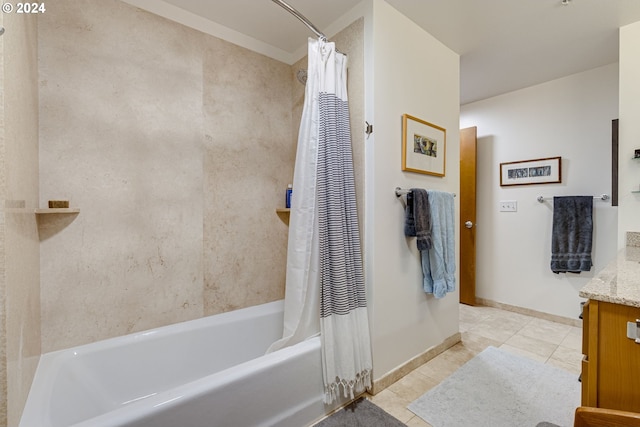 bathroom featuring vanity, baseboards, tile patterned floors, and shower / bath combination with curtain