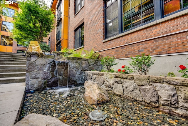 exterior space featuring brick siding