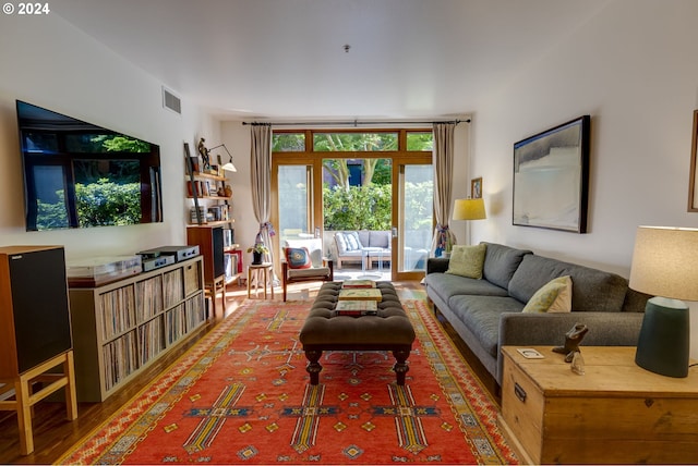 living room featuring visible vents