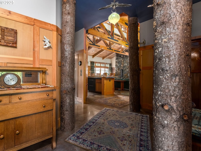 corridor featuring lofted ceiling