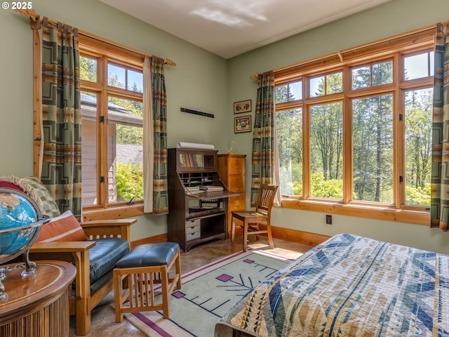 carpeted bedroom featuring baseboards