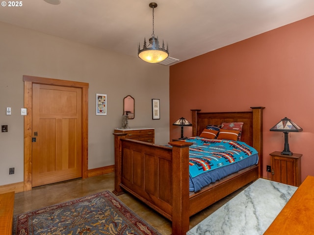 bedroom with baseboards, concrete floors, and visible vents