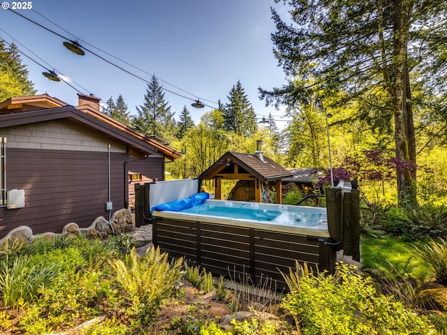 exterior space featuring a hot tub