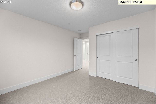 4206 NE 188th St Lot 328, Vancouver, WA 98686 - unfurnished bedroom featuring a closet, baseboards, and carpet floors