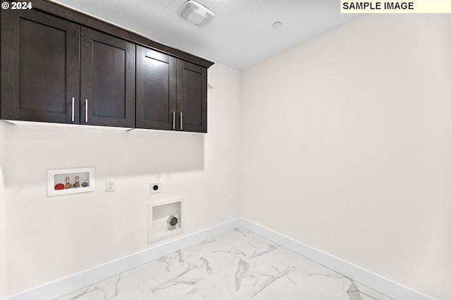 4206 NE 188th St Lot 328, Vancouver, WA 98686 - clothes washing area with baseboards, marble finish floor, washer hookup, cabinet space, and electric dryer hookup