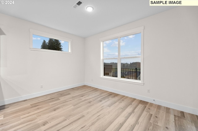 4206 NE 188th St Lot 328, Vancouver, WA 98686 - unfurnished room with visible vents, light wood-style flooring, and baseboards