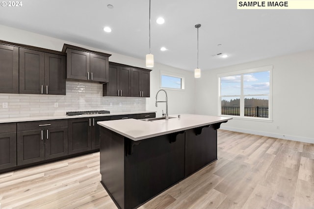 4206 NE 188th St Lot 328, Vancouver, WA 98686 - kitchen featuring light wood finished floors, a sink, light countertops, decorative backsplash, and stainless steel gas cooktop