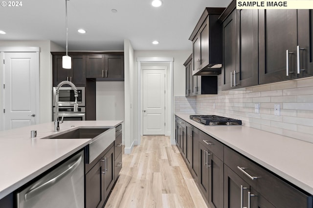4206 NE 188th St Lot 328, Vancouver, WA 98686 - kitchen with light wood-style flooring, recessed lighting, decorative backsplash, light countertops, and appliances with stainless steel finishes