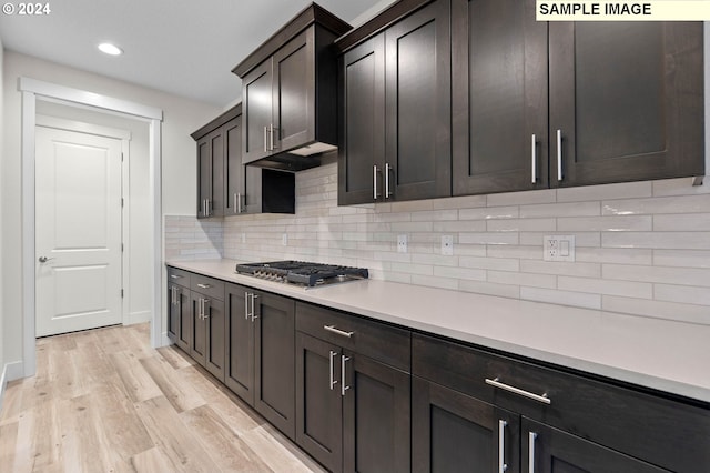 4206 NE 188th St Lot 328, Vancouver, WA 98686 - kitchen with light wood finished floors, backsplash, light countertops, stainless steel gas stovetop, and recessed lighting