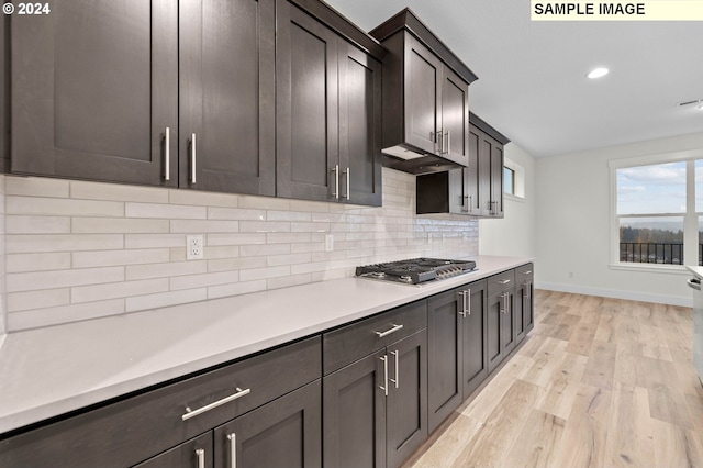 4206 NE 188th St Lot 328, Vancouver, WA 98686 - kitchen with light wood-type flooring, stainless steel gas cooktop, decorative backsplash, light countertops, and baseboards