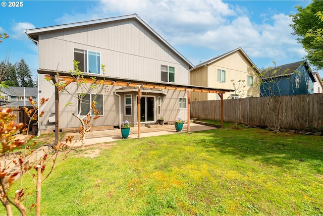 back of house featuring a patio, a fenced backyard, and a yard