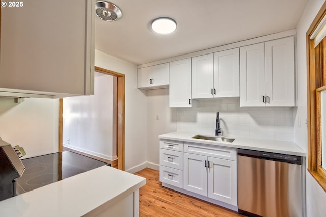 3406 E 12th St, Vancouver, WA 98660 - kitchen with dishwasher, range with electric cooktop, light countertops, and white cabinets