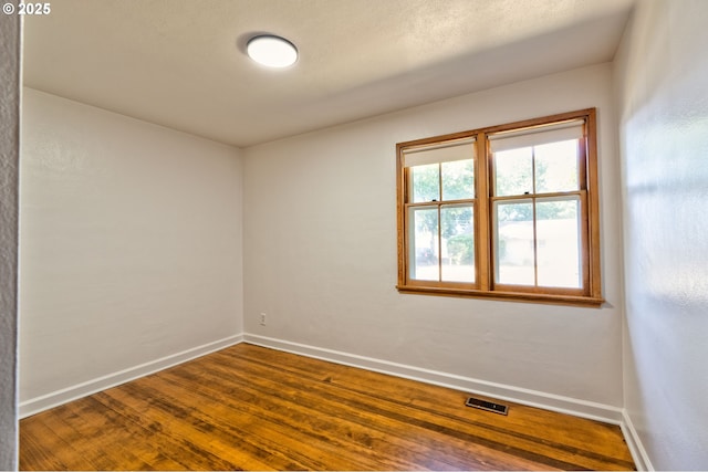 3406 E 12th St, Vancouver, WA 98660 - unfurnished room featuring baseboards and dark wood-style flooring