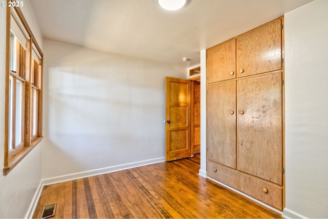 3406 E 12th St, Vancouver, WA 98660 - unfurnished bedroom featuring dark wood-type flooring and a closet