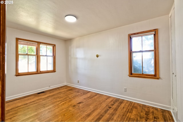 3406 E 12th St, Vancouver, WA 98660 - empty room featuring wood finished floors and healthy amount of natural light