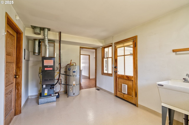 3406 E 12th St, Vancouver, WA 98660 - utility room featuring water heater and a sink
