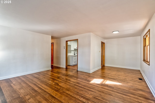 3406 E 12th St, Vancouver, WA 98660 - unfurnished room featuring dark wood-type flooring and baseboards