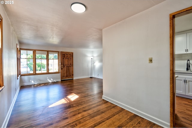 3406 E 12th St, Vancouver, WA 98660 - foyer entrance featuring dark wood-type flooring and baseboards