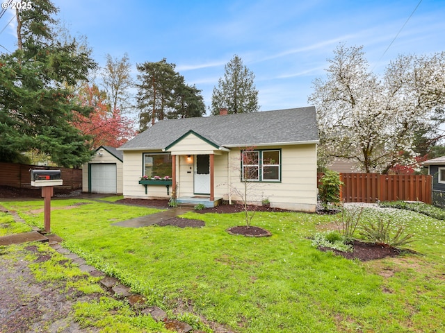 ranch-style house with a front lawn, fence, a garage, and roof with shingles