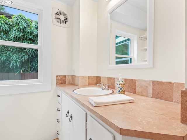 bathroom with vanity and visible vents