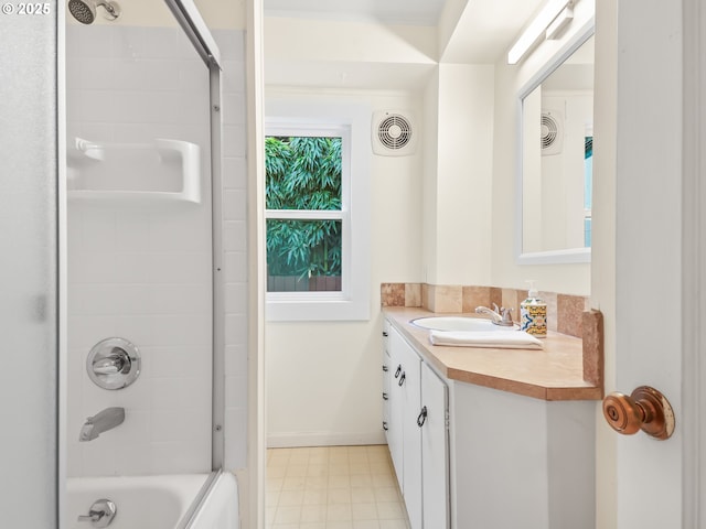 full bathroom with visible vents, vanity, and bathing tub / shower combination