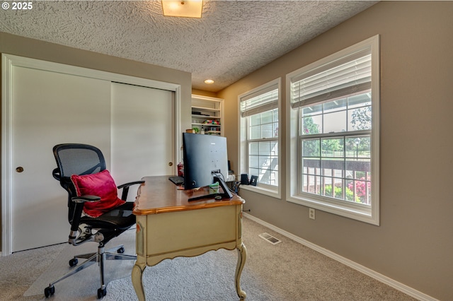 home office featuring carpet flooring, a textured ceiling, baseboards, and recessed lighting