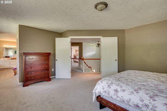 bedroom featuring carpet flooring and a textured ceiling